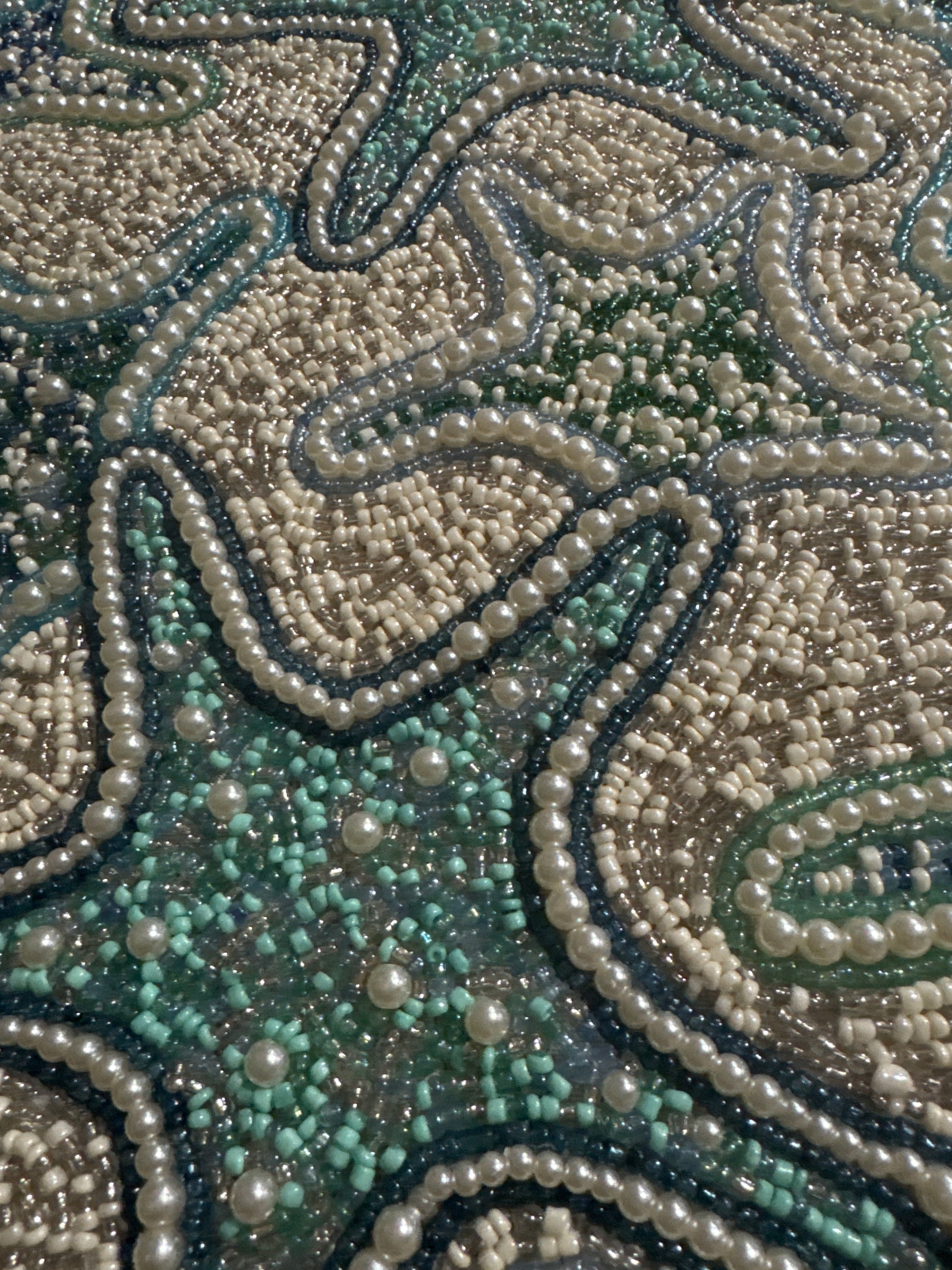 Handmade Round Starfish Beaded Placemat with intricate beading, featuring a coastal design with starfish patterns in soft shades of blue, green, and beige, 15-inch diameter