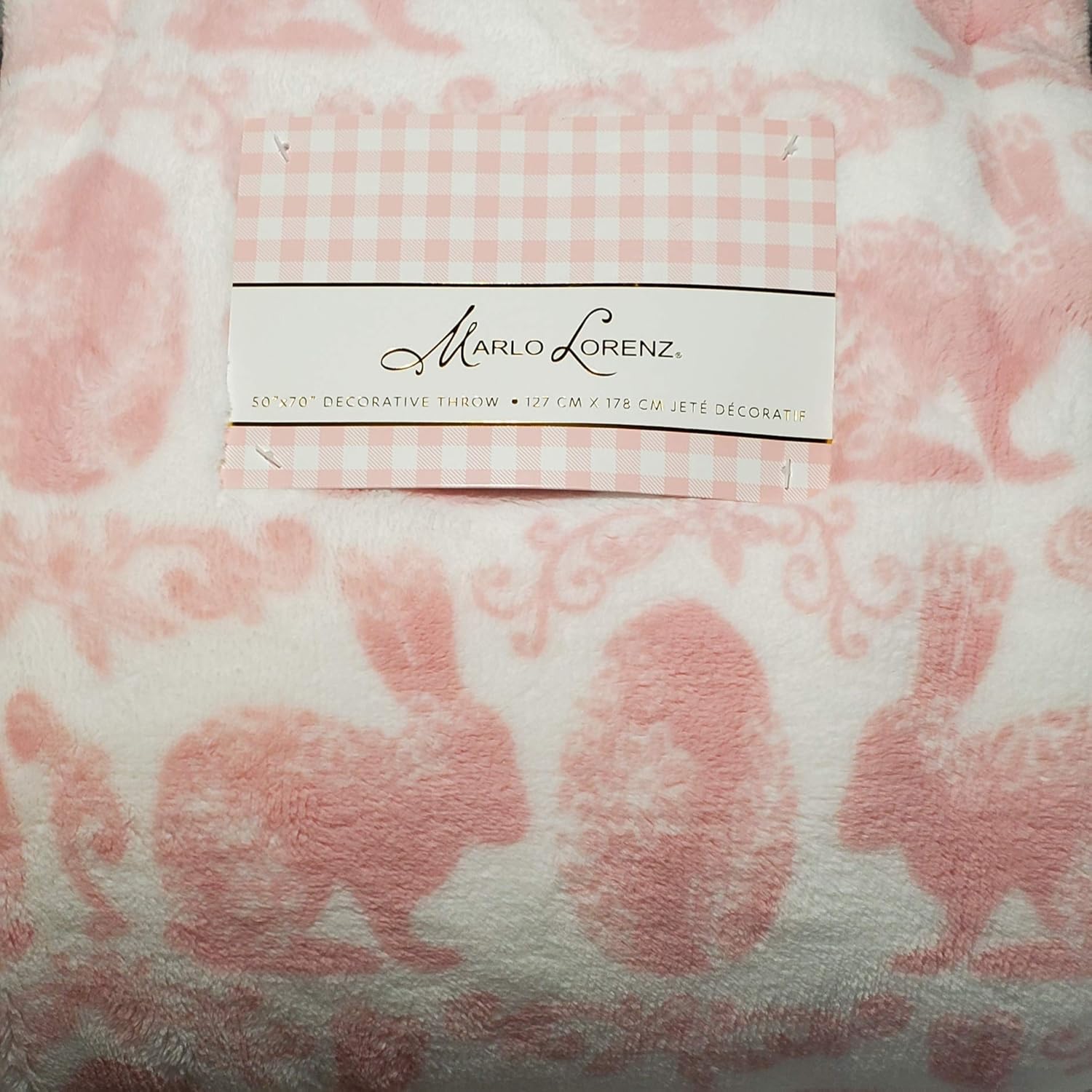 Soft pink and white plush throw blanket with bunny and Easter egg scroll design, 50" x 70", Marlo Lorenz.