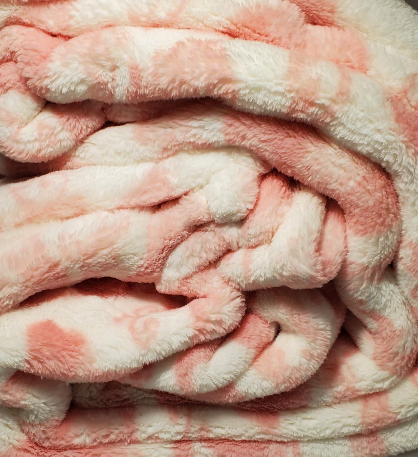 Soft pink and white plush throw blanket with bunny and Easter egg scroll design, 50" x 70", Marlo Lorenz.