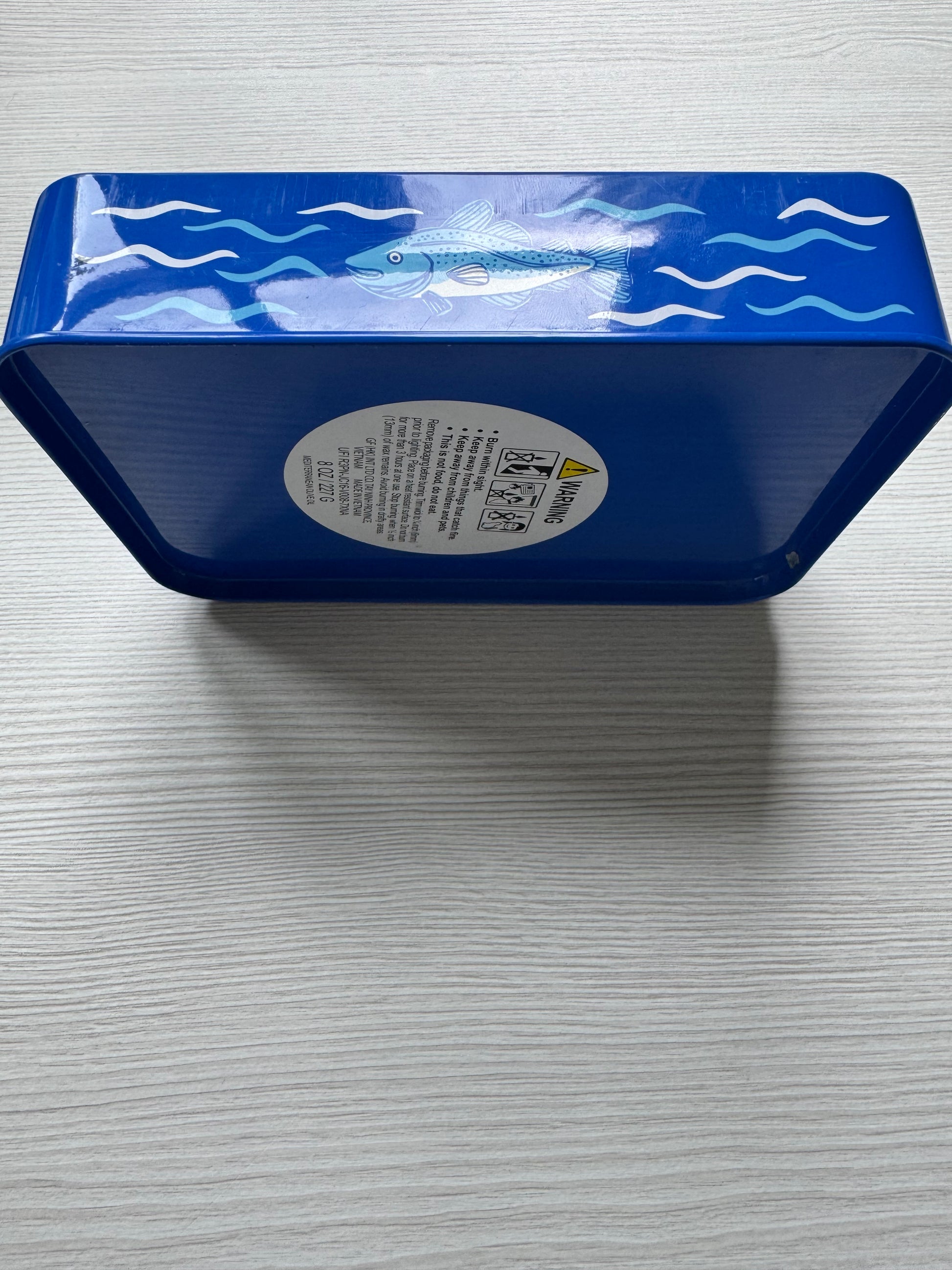 Coastal sardine tin with two colorful fish-shaped Mediterranean olive oil scented candles