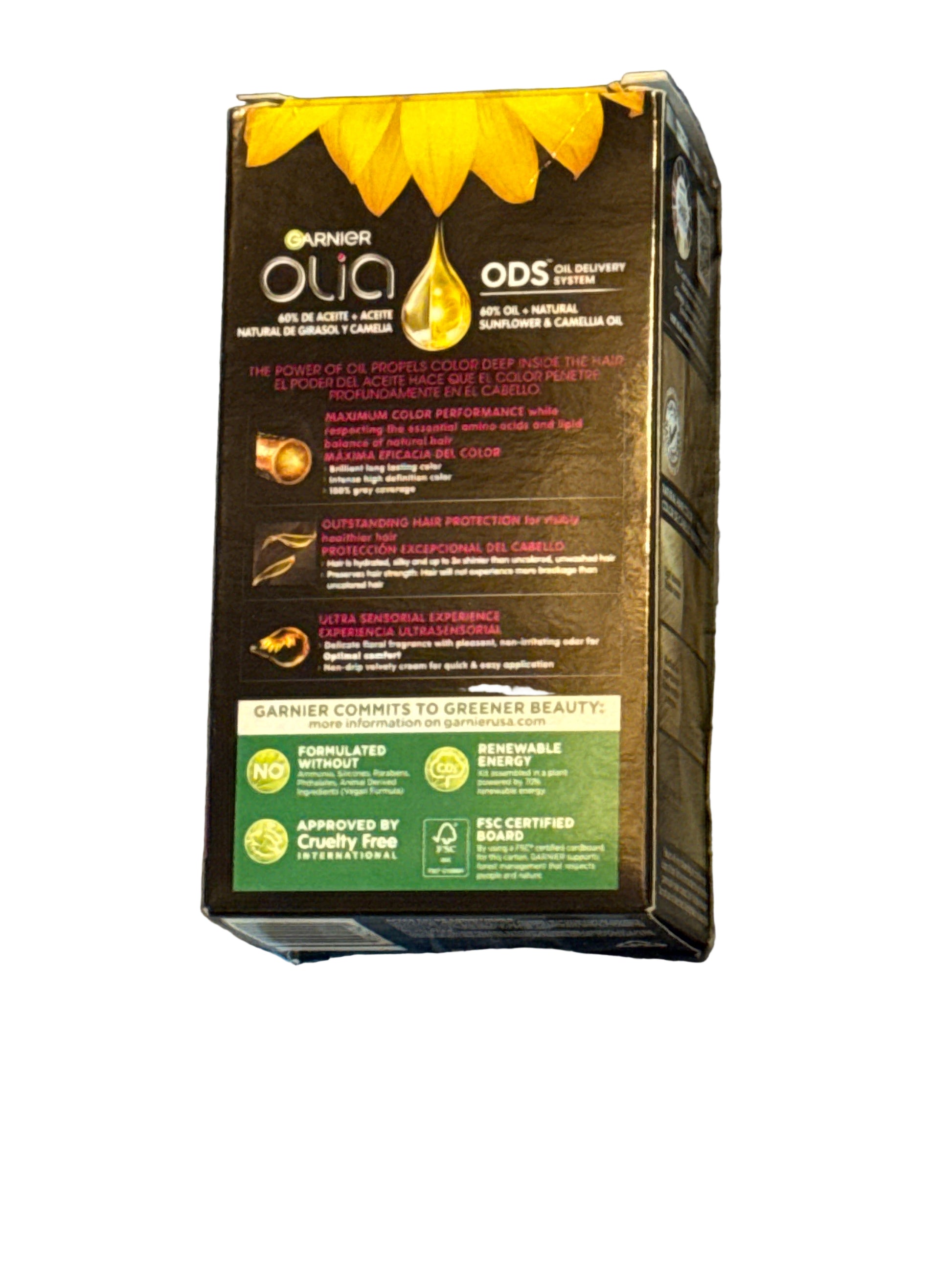 Front of Garnier Olia hair color box showing shade 8.0 Medium Blonde
Back of hair color box with instructions and ingredient information
Side view of Garnier Olia packaging displaying oil-powered color branding