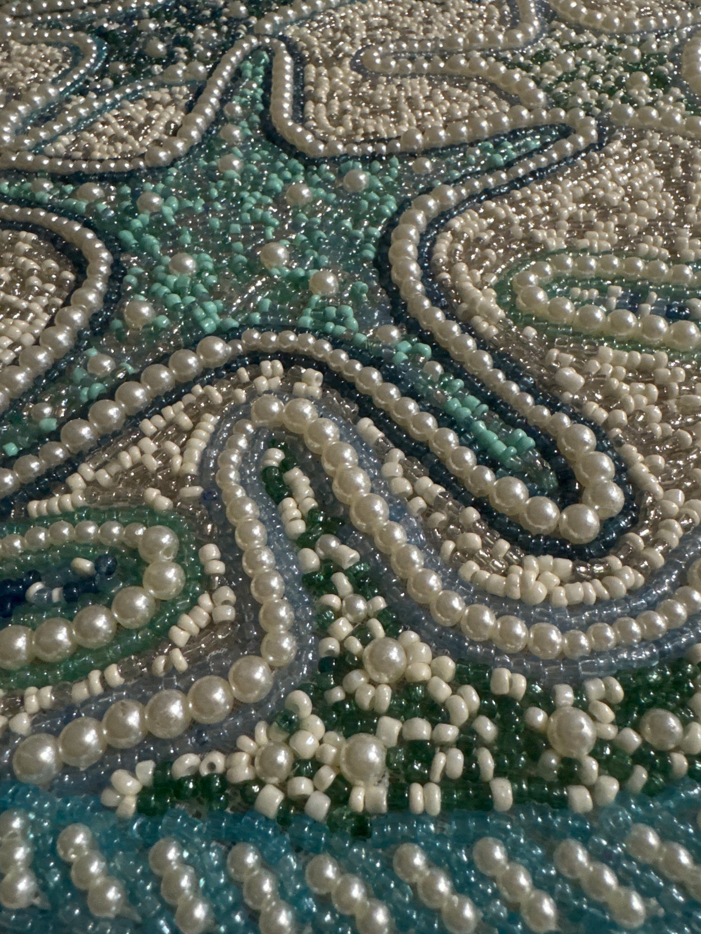 Handmade Round Starfish Beaded Placemat with intricate beading, featuring a coastal design with starfish patterns in soft shades of blue, green, and beige, 15-inch diameter