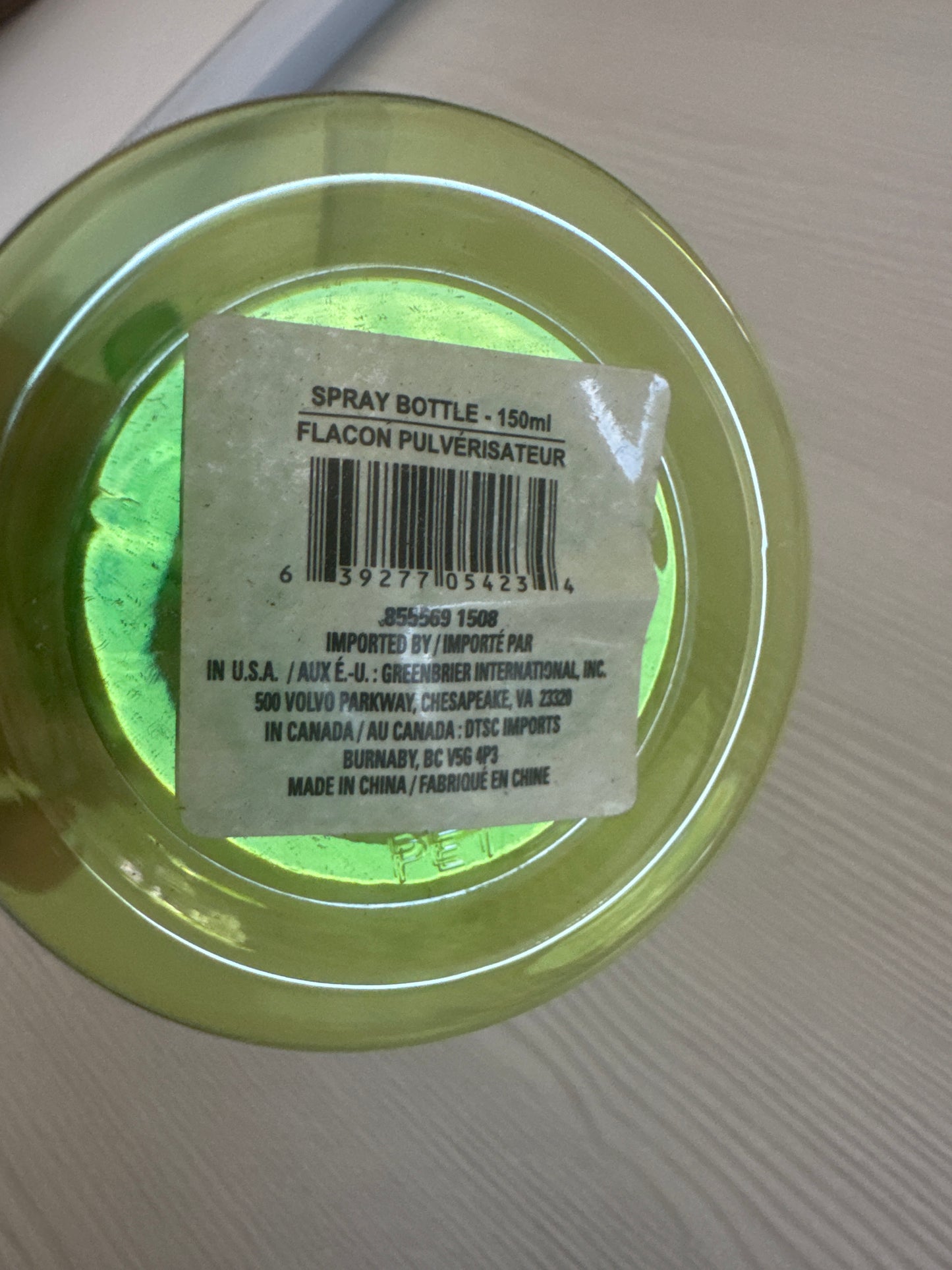 Green plastic spray bottle with trigger sprayer