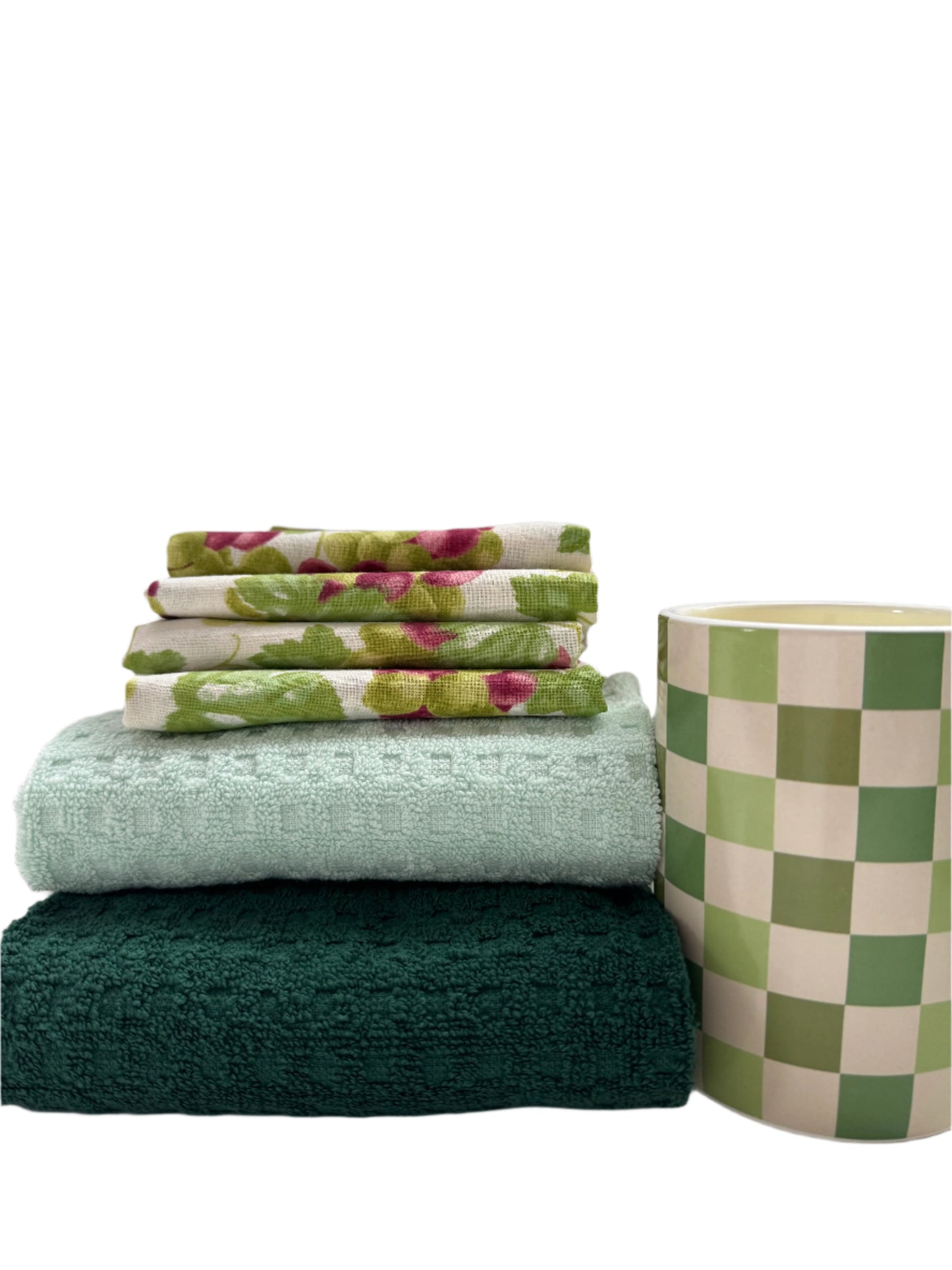 Charming kitchen gift set featuring 4 hand-screen printed cotton napkins with a grape design, 2 cotton towels in soft pastel green and teal, and a yellow scented candle. Perfect for enhancing your kitchen or as a thoughtful gift. The set showcases elegant, functional kitchen essentials