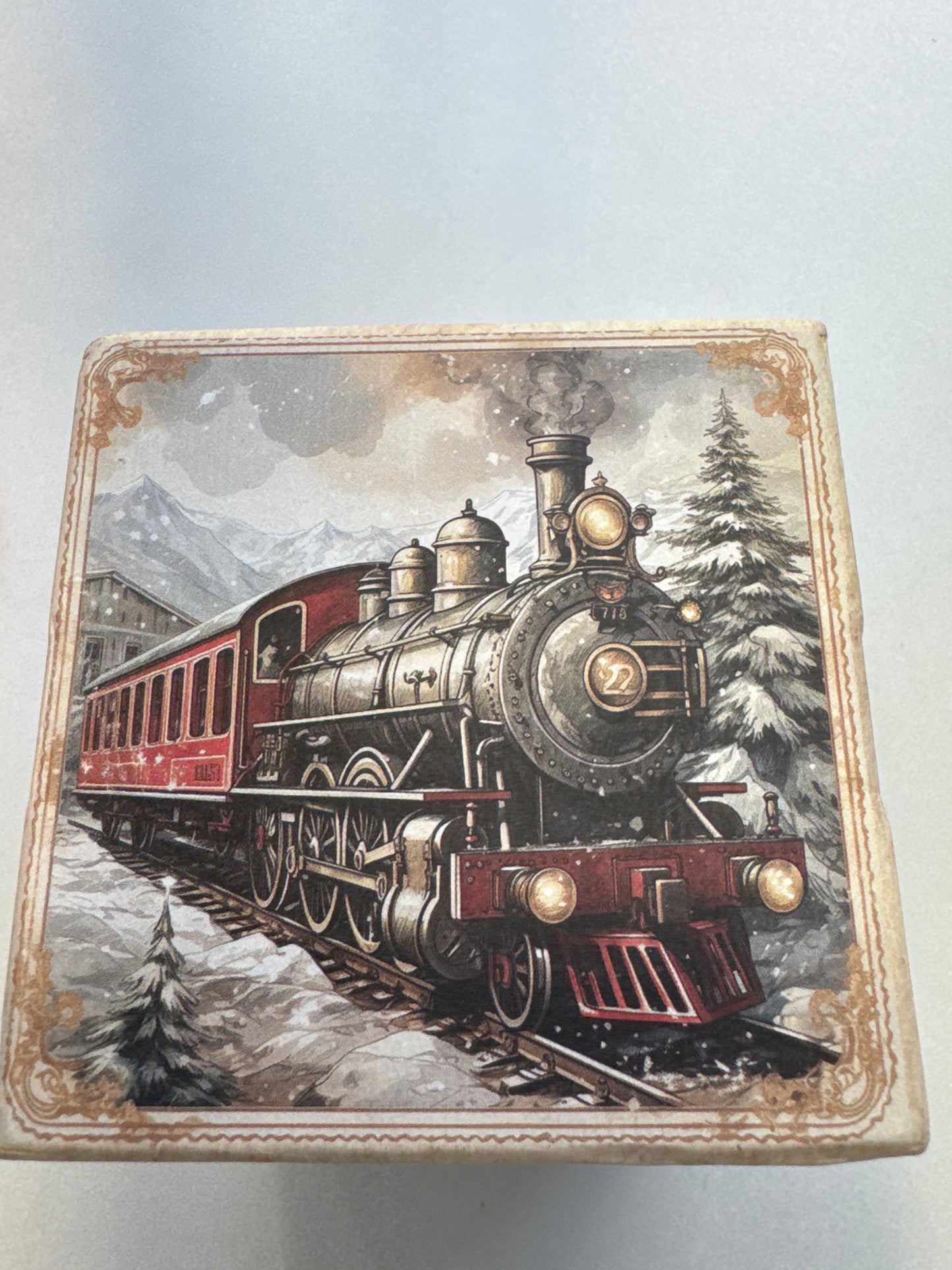 Three-bar soap gift set with vintage-style holiday packaging, tied with red ribbon, scented in vanilla and honey.