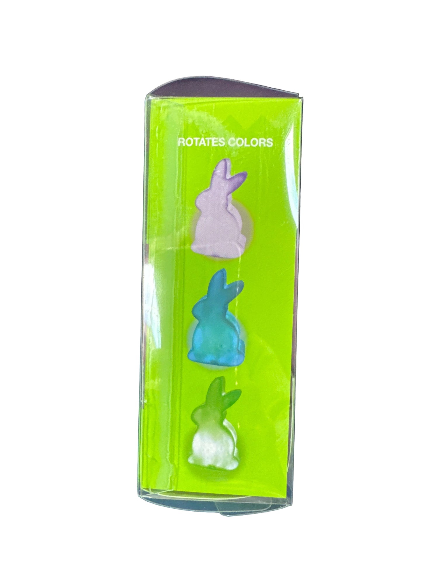 Set of three rabbit-shaped erasers in a green box on a dark blue background