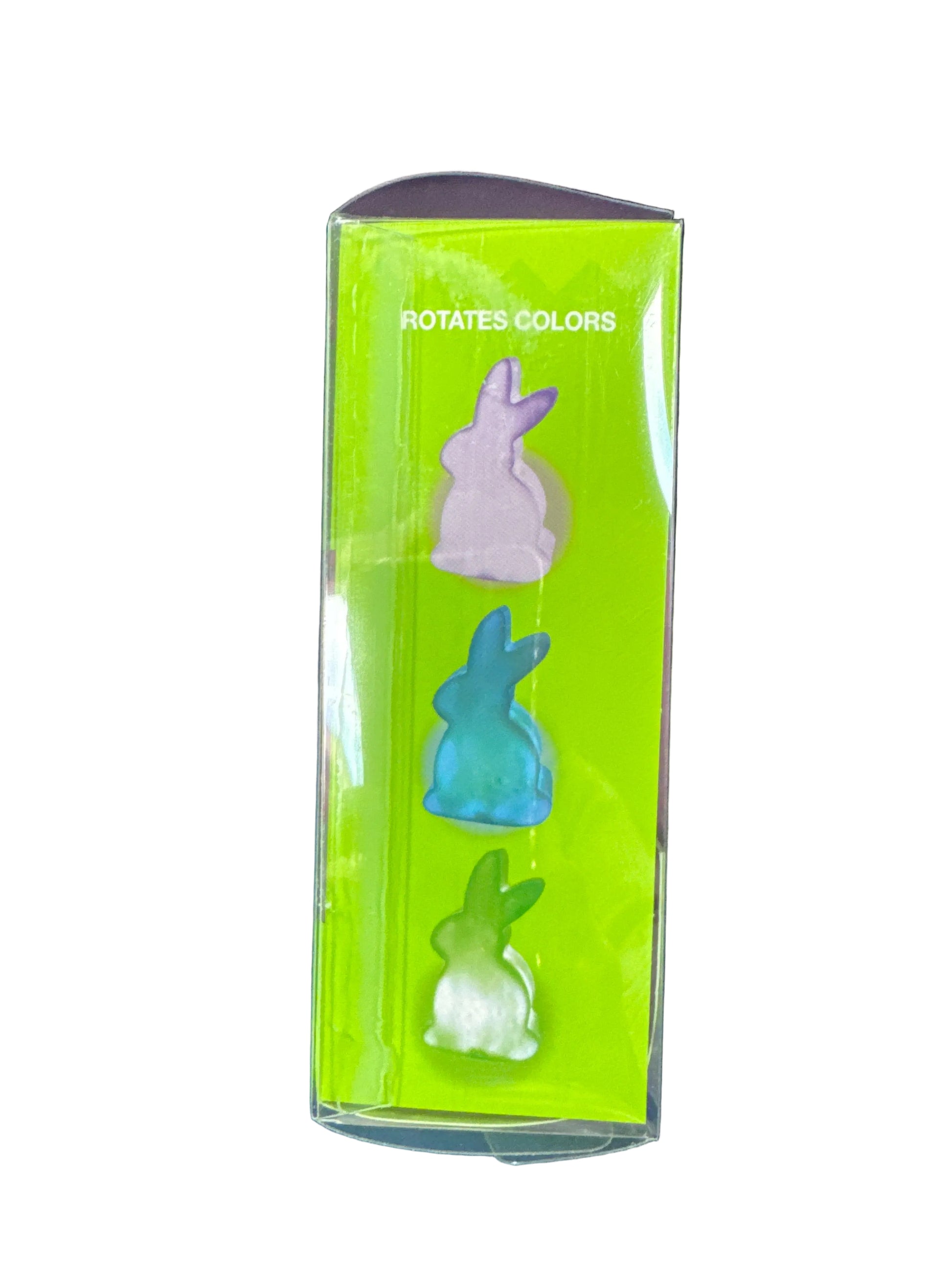 Set of three rabbit-shaped erasers in a green box on a dark blue background