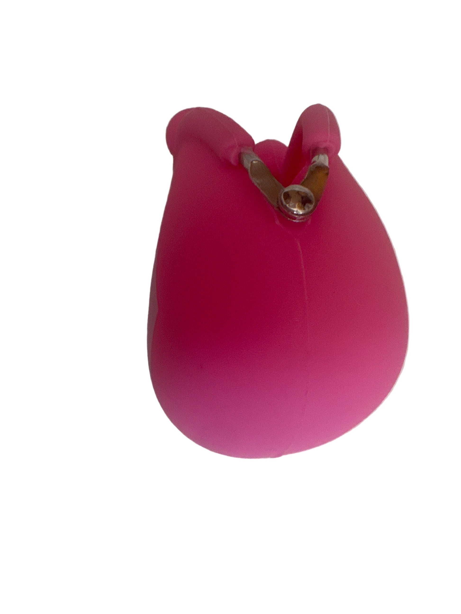 Bright pink silicone coin purse with clasp closure, photographed on a light surface
