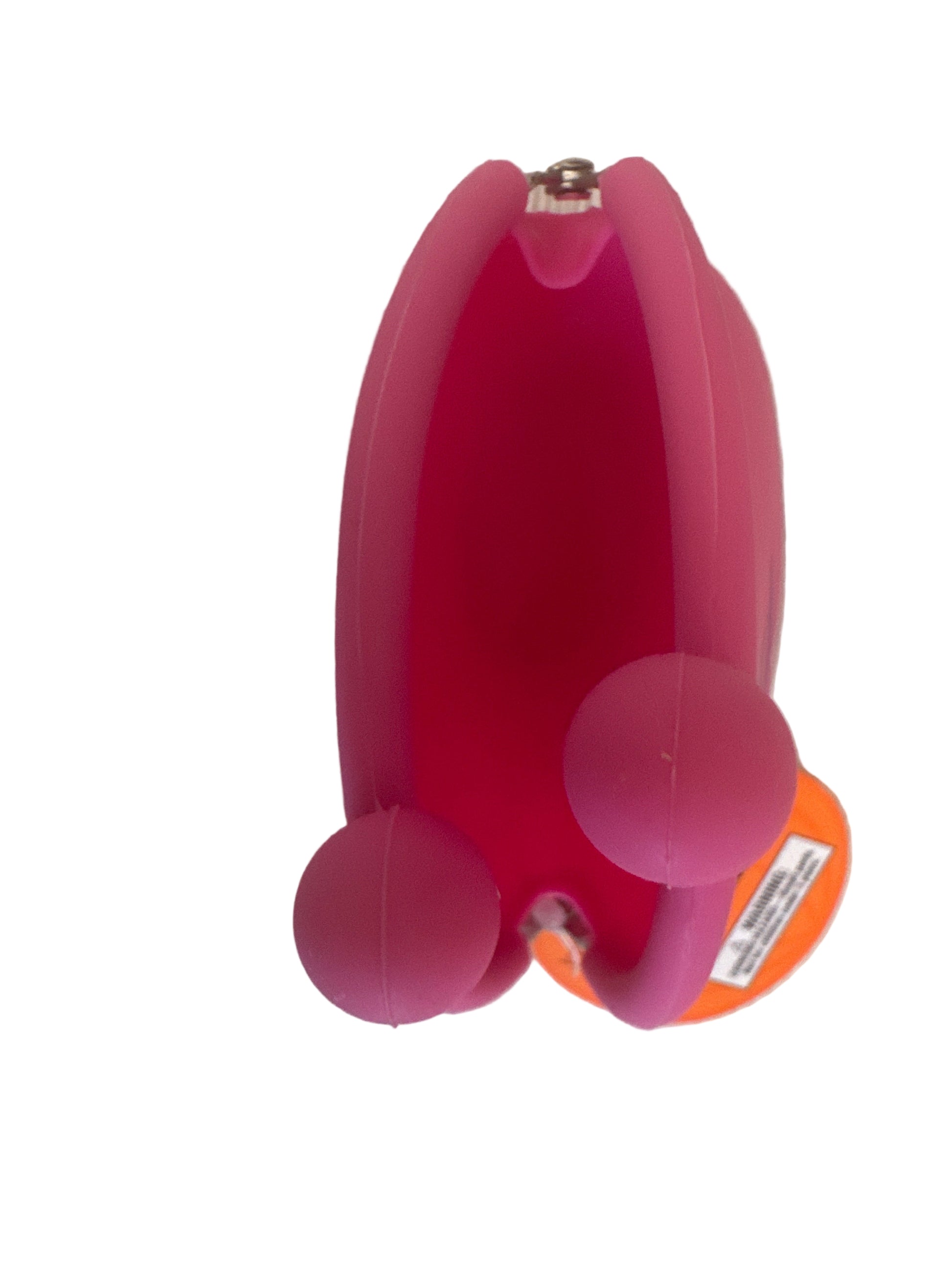 Bright pink silicone coin purse with clasp closure, photographed on a light surface