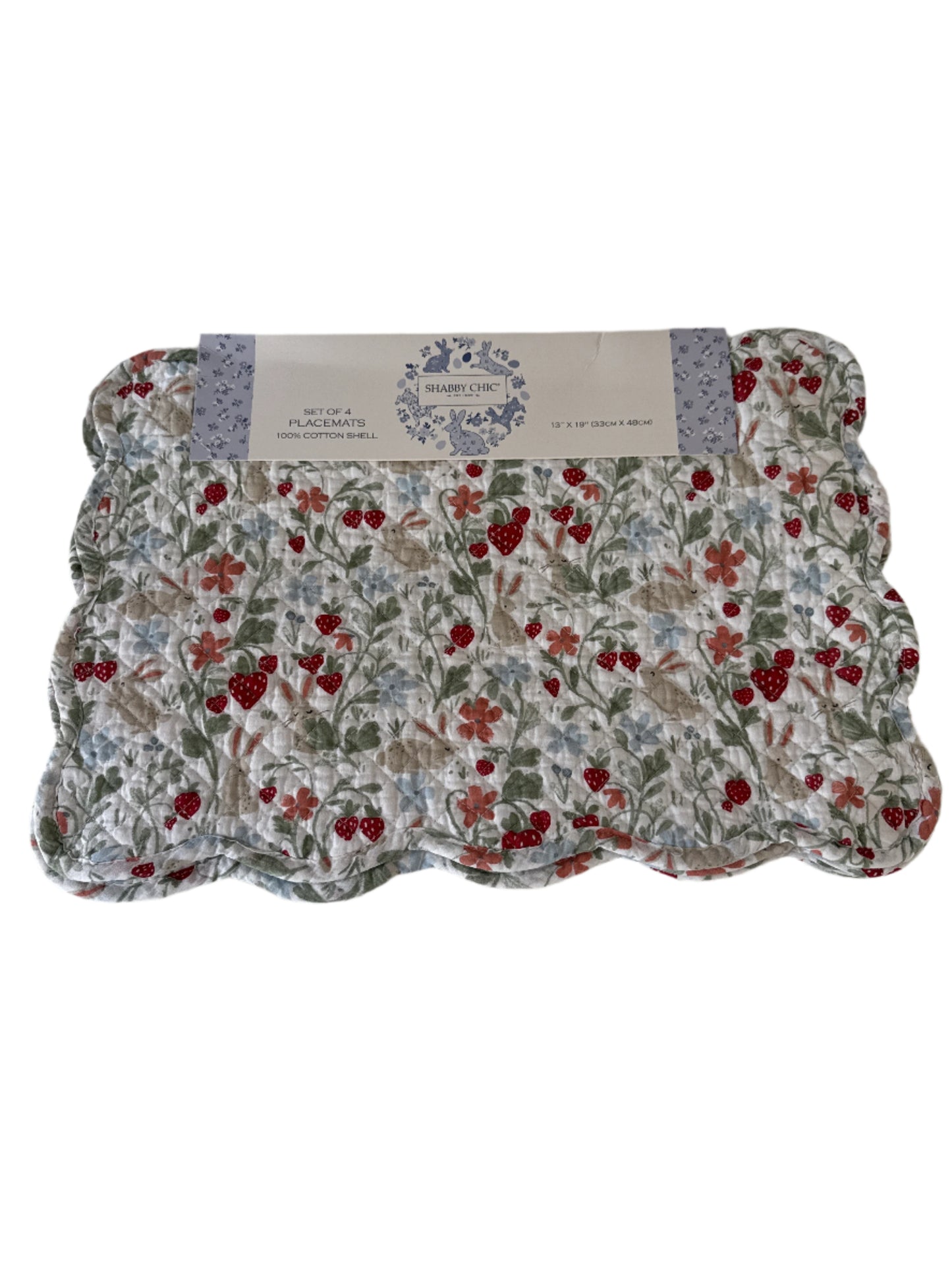 A set of 4 reversible cotton placemats featuring a charming strawberry and floral pattern in red and green, with a scalloped edge. The placemats are packaged with a label reading "Set of 4 Placemat 100% Cotton Shell," measuring 13" x 19"