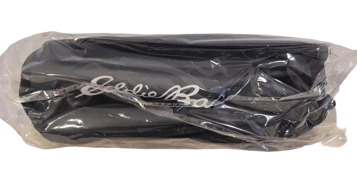 Toiletry bag sealed in clear plastic packaging 