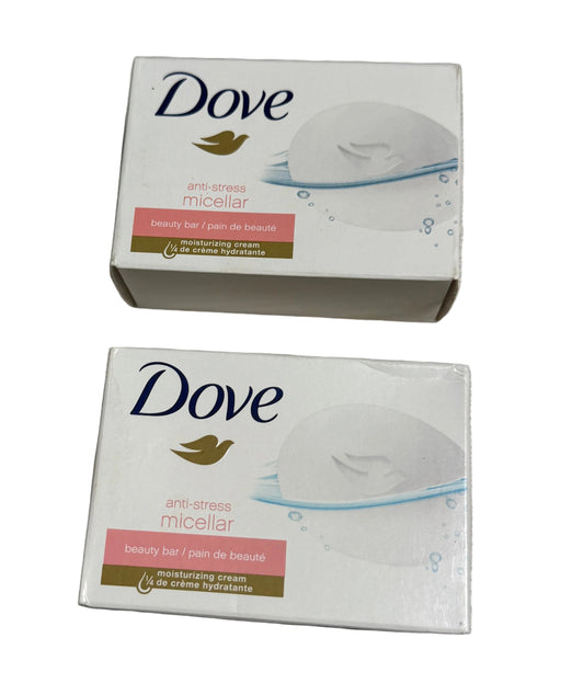 Two Dove soap boxes on a gray surface