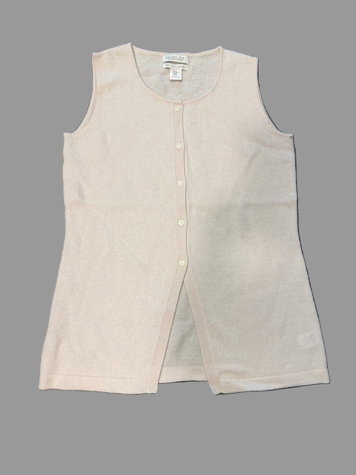 A light beige sleeveless knit vest with a button-up front. 