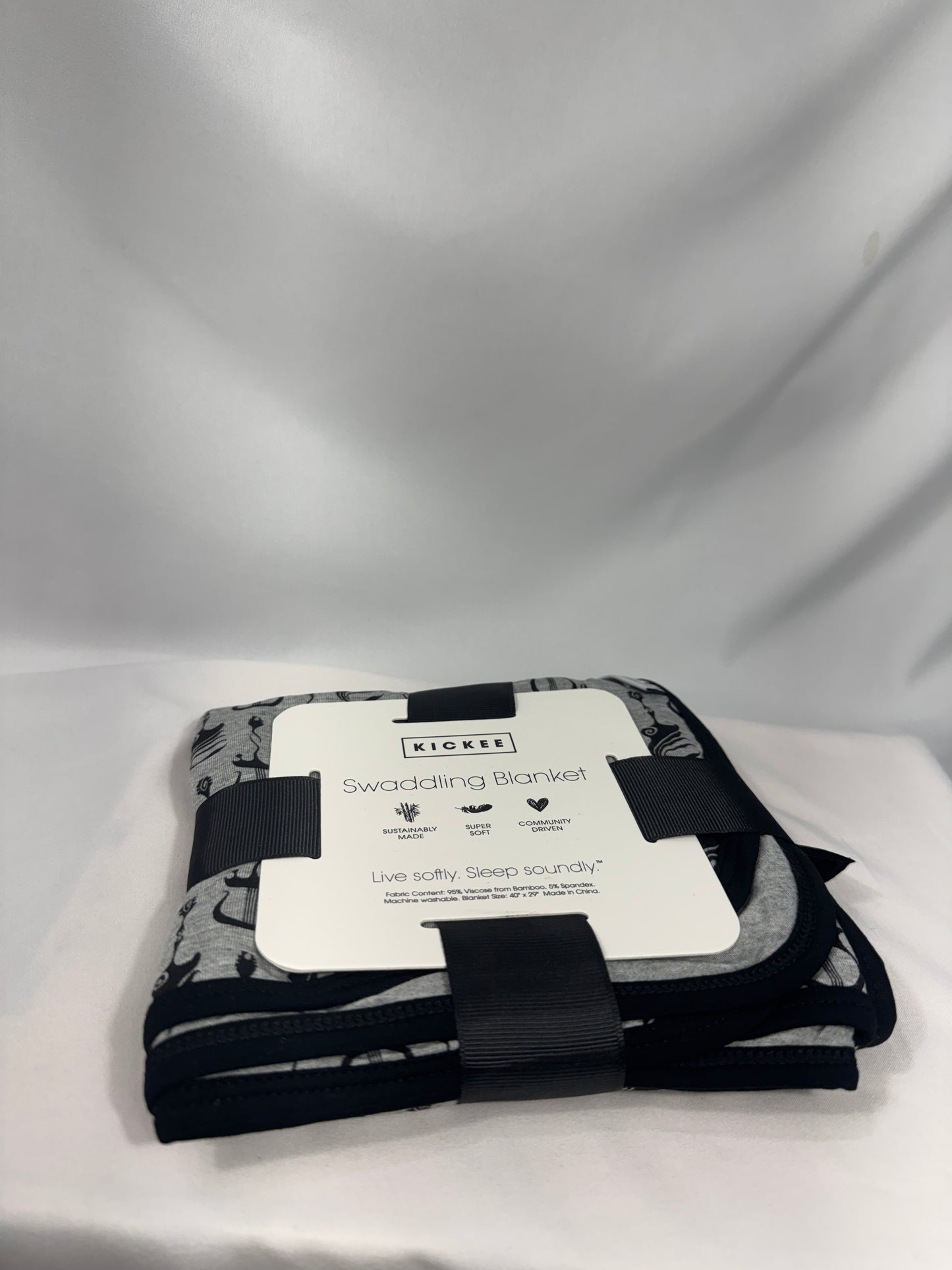 Black and white patterned product with a label on a light gray background