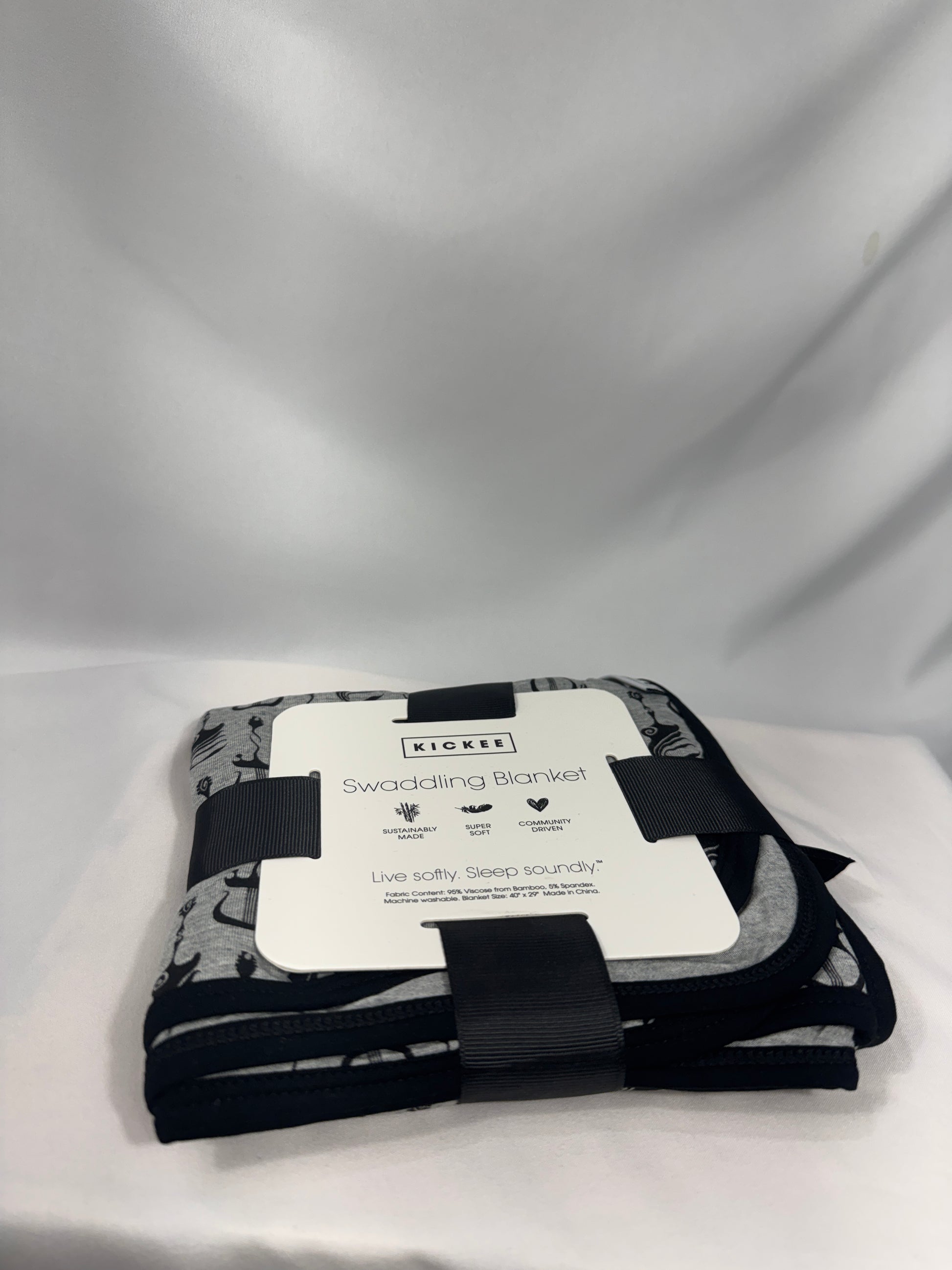 Black and white patterned product with a label on a light gray background
