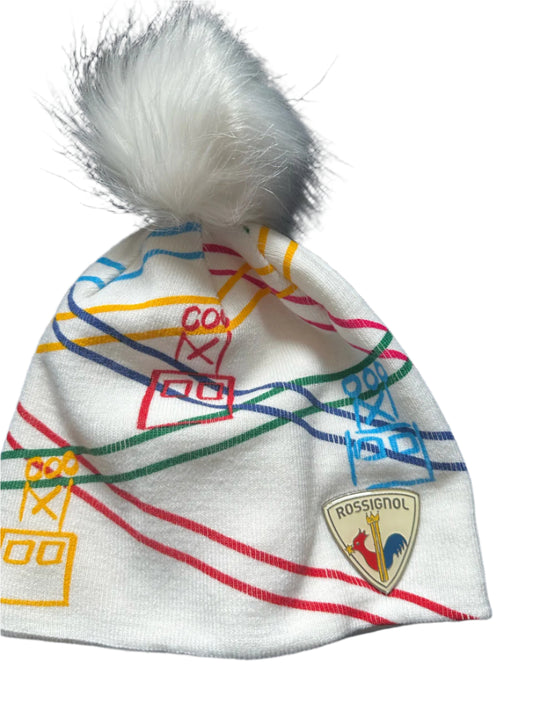 White beanie with multicolor gondola print and white faux-fur pom.