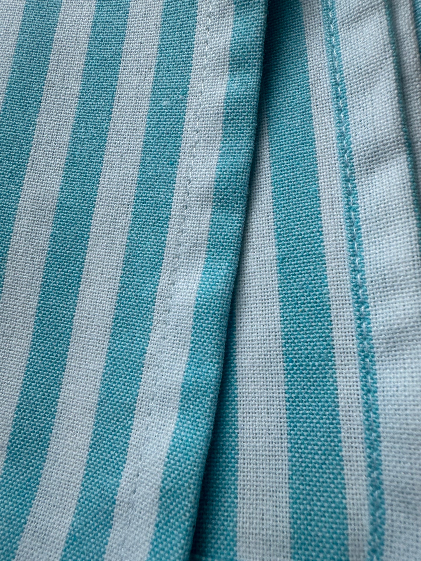 Set of 8 cotton cloth napkins in ocean mist blue and white stripe pattern measuring 18 x 18 inches by Monarch Linens