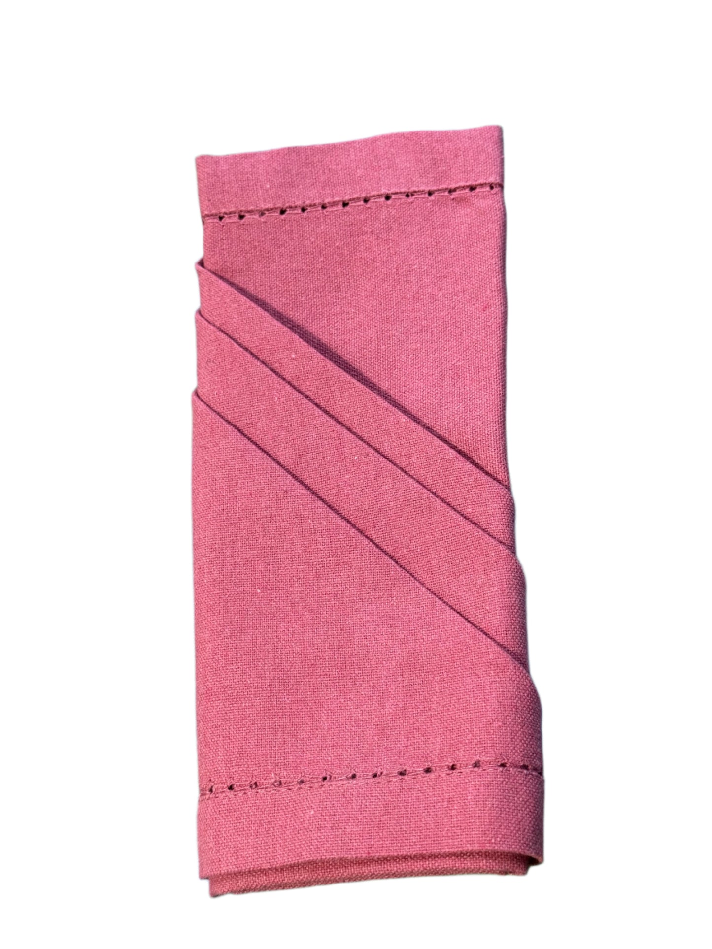 Burgundy cotton napkin neatly rolled with an elegant diagonal fold, showcasing the clean edges and fine stitching for a polished presentation