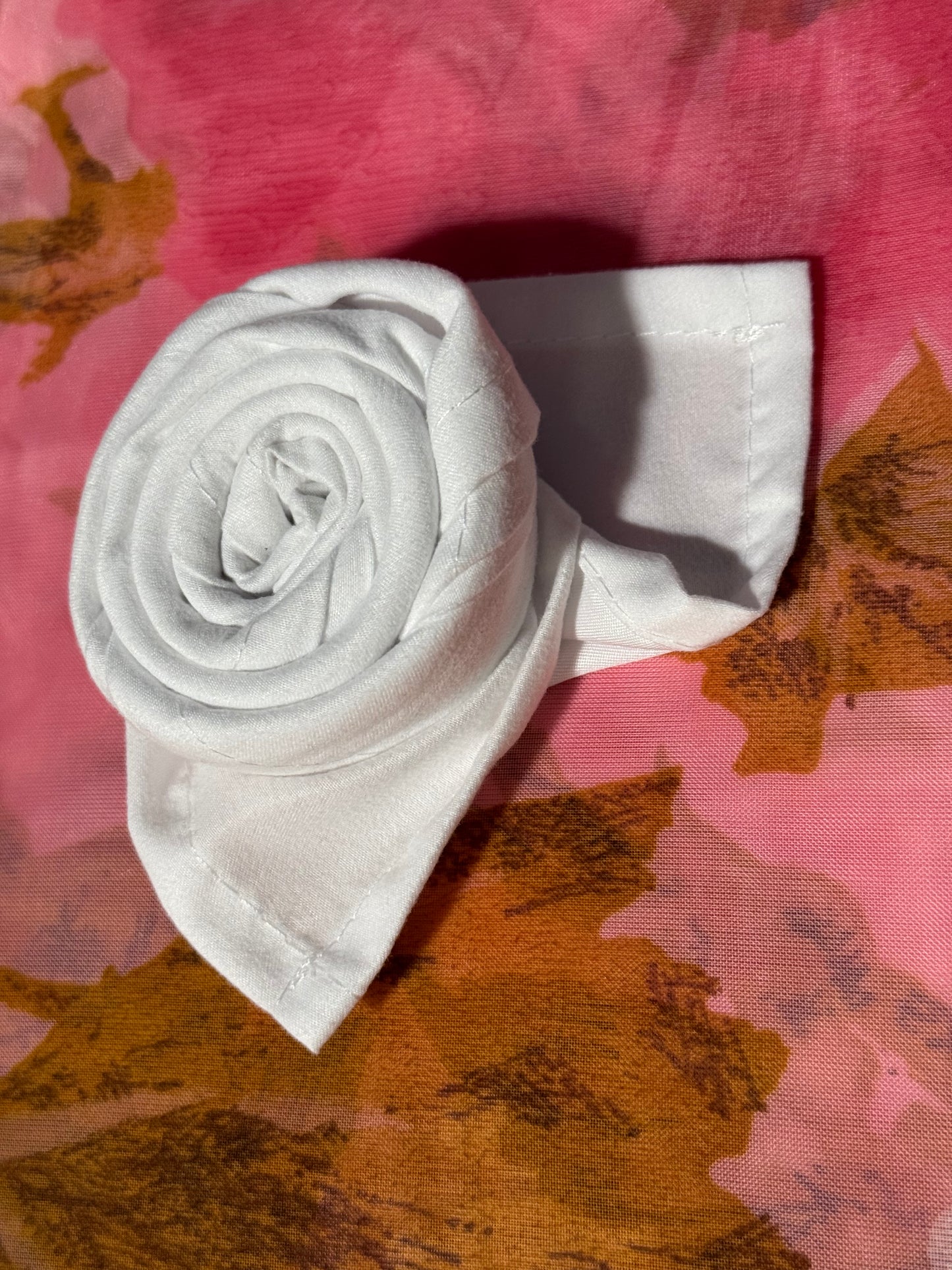 White polyester cloth napkins 18 x 18 inches set of eight by Monarch Linens shown folded and styled for formal and everyday table settings