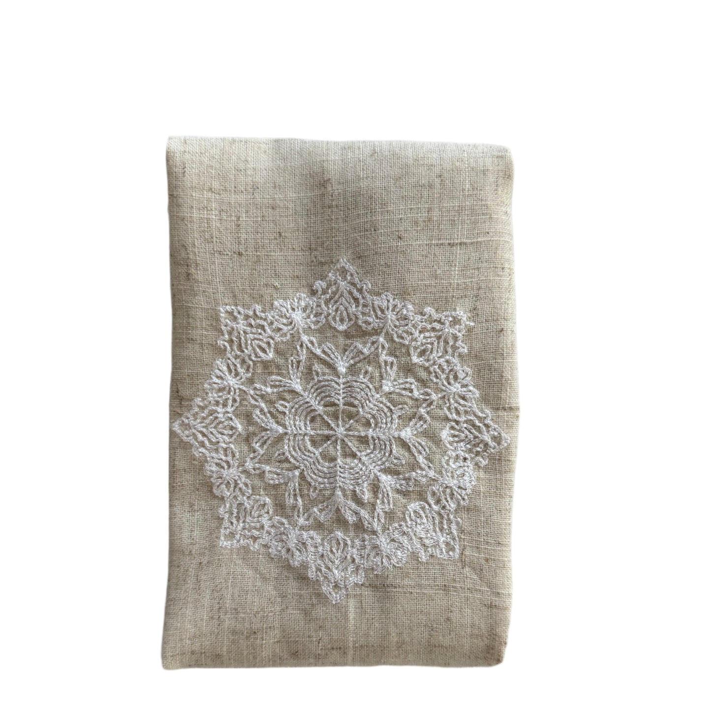 Natural beige linen dinner napkin with delicate embroidered detail and hemstitched edges, 17 x 17 inch reusable cloth napkin styled on an elegant table setting