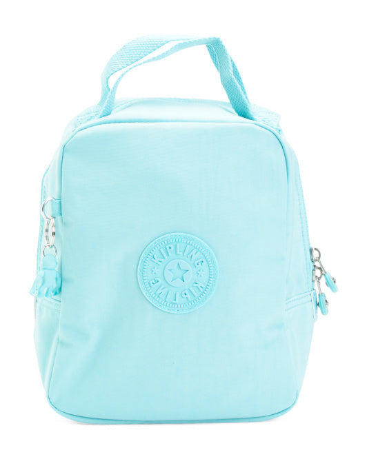 Kipling Lyla insulated lunch bag in light blue nylon with monkey keychain, reusable 9″ × 5″ × 10″ tote for work or picnics.