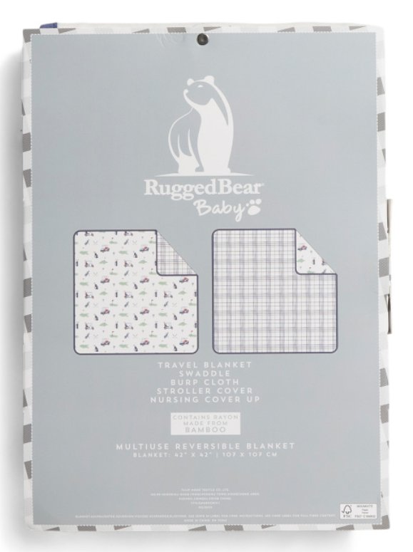 Reversible golf-themed baby blanket by Rugged Bear, folded and packaged