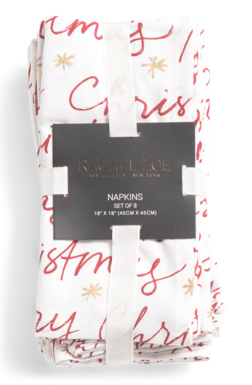 Set of eight Merry Christmas script holiday napkins with red lettering and gold accents.
