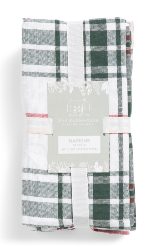Set of eight plaid cotton napkins in white, green, and red holiday pattern.