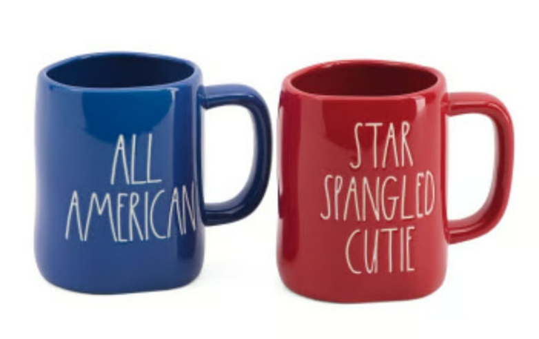 Red and blue ceramic mugs with patriotic text reading All American and Star Spangled Cutie
