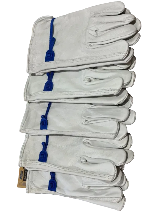 Stack of white gloves with blue accents on a patterned fabric background