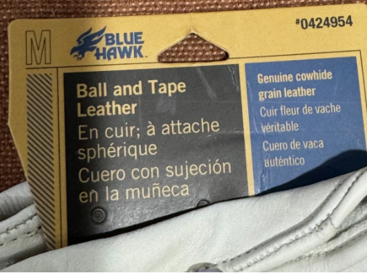 Blue Hawk leather label on a product with brown background