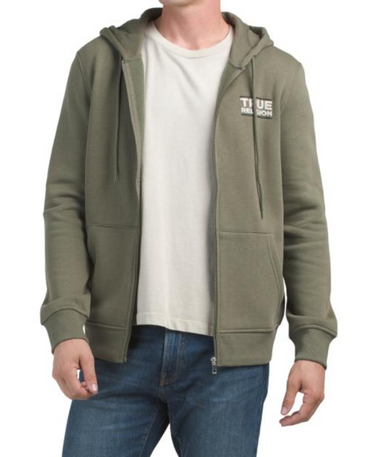 Person wearing a green hoodie with 'True Religion' branding on a white background