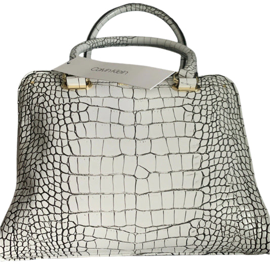 Calvin Klein white crocodile leather handbag with gold accents, adjustable crossbody strap, and black interior with multiple pockets.