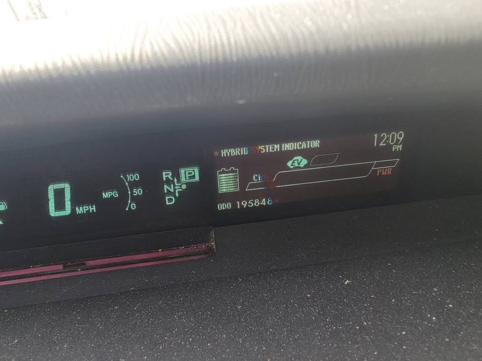 Toyota Prius hybrid system indicator display showing 0 MPH speed, EV mode, and 195,846 miles on the odometer.