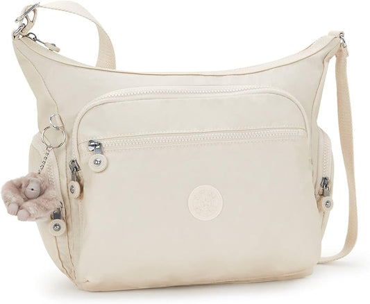 Lightweight cream nylon crossbody shoulder bag with multiple zipper pockets, adjustable strap, and plush monkey keychain – size 11.5" x 8.75" x 6.5"