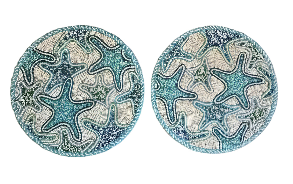 Two handmade beaded placemats with intricate starfish designs in shades of blue, green, and white, featuring high-quality craftsmanship and a coastal-inspired aesthetic