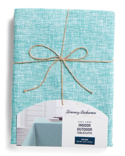 60x84 woven cross-dyed blue tablecloth by Tommy Bahama, folded with product tags